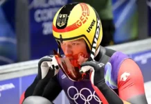 Max Langenhan holt Goldmedaille für Deutschland 2026 Max Langenhan feiert mit der Deutschlandfahne nach dem Olympia-Triumph